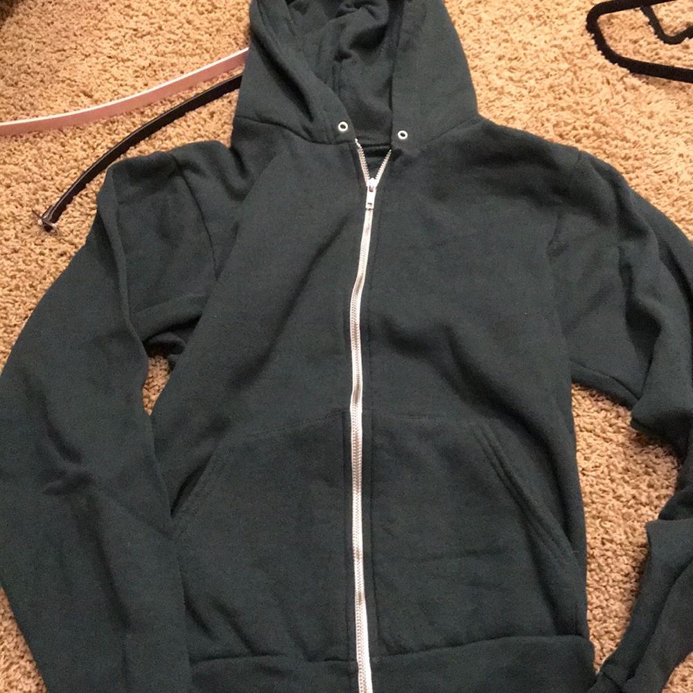 Green zip up sweatshirt.